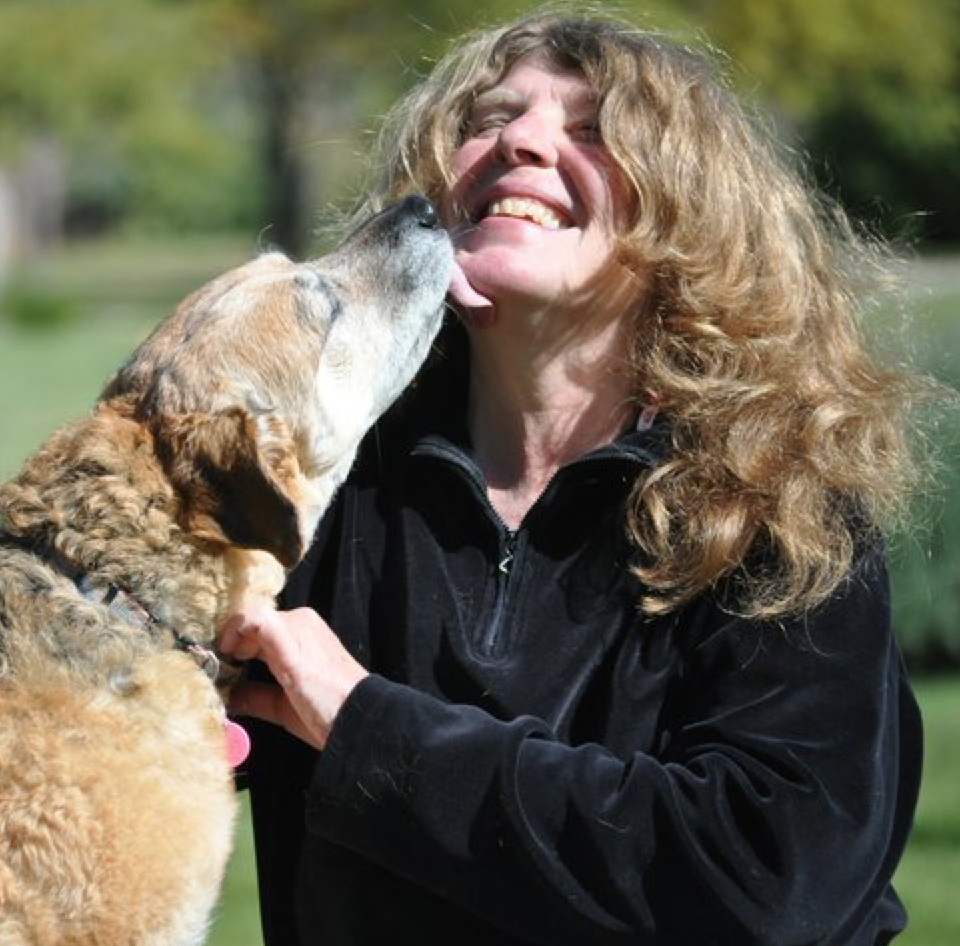 Portrait of Sally Evans with her dog