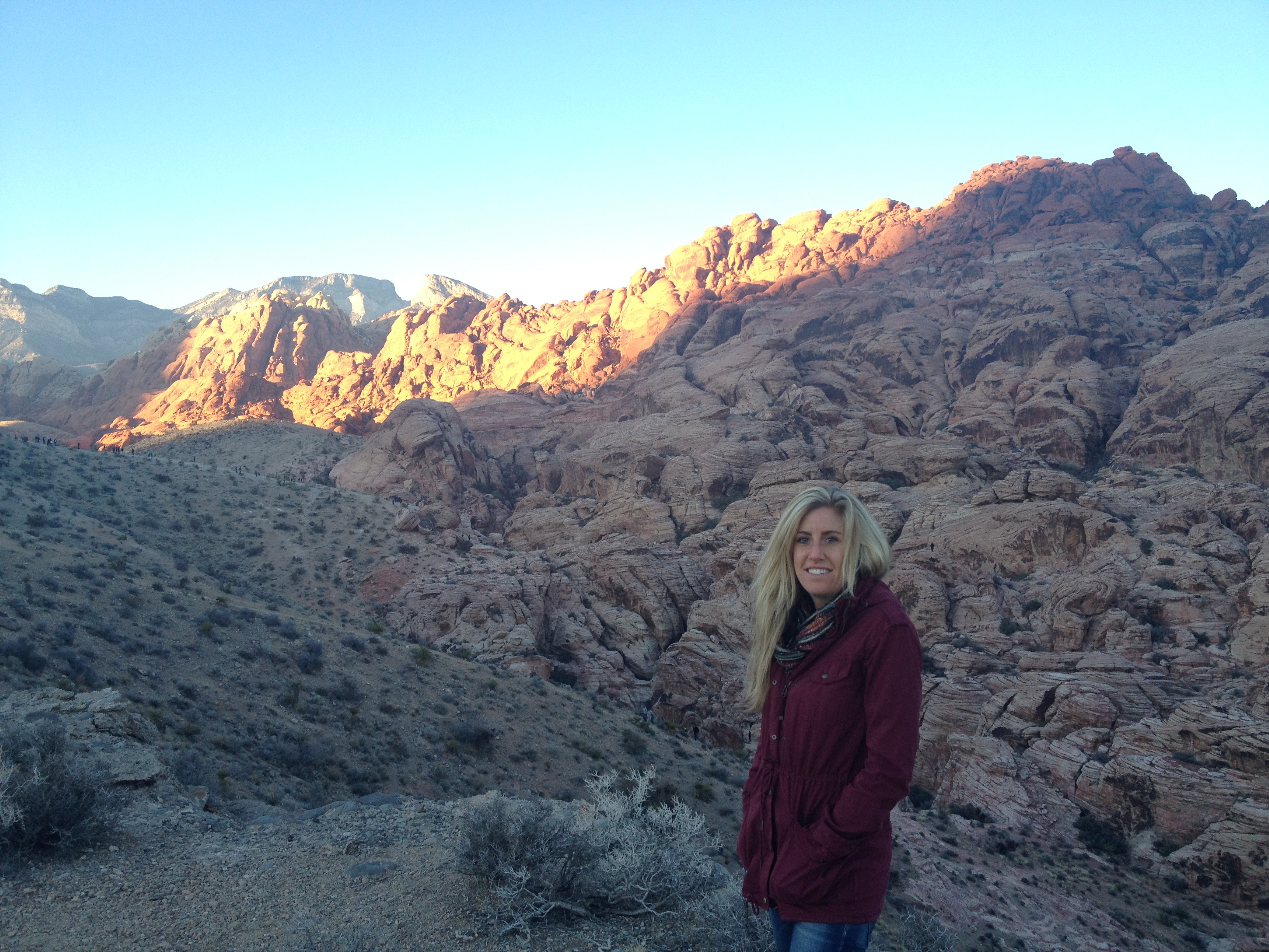 Portrait of Xanthe Walker, post-doctoral scientist, in rocky landscape.